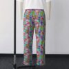 Classic Strawberry Shortcake all-over pattern lounge pants on turquoise background  