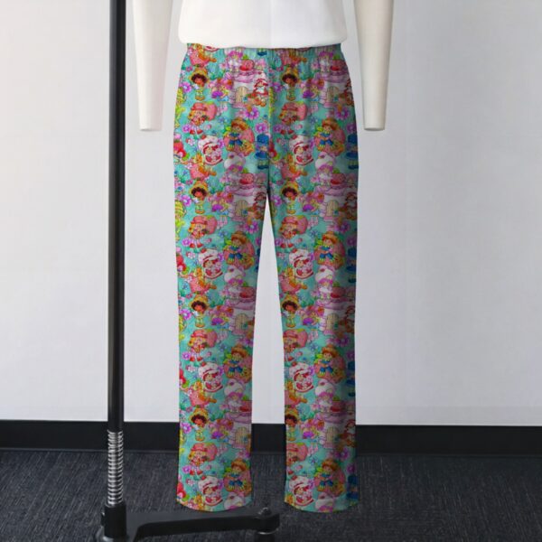 Classic Strawberry Shortcake all-over pattern lounge pants on turquoise background  